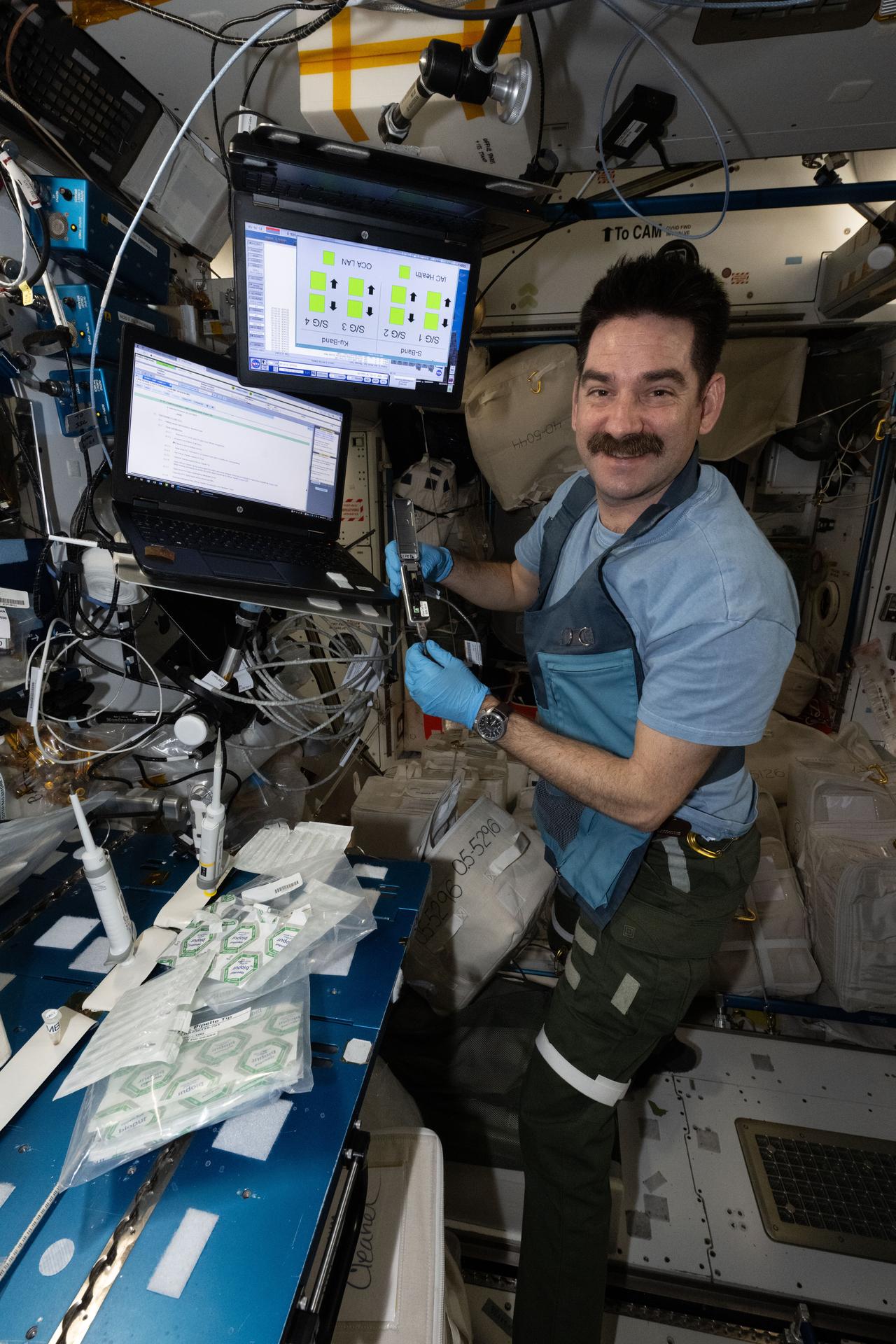 Crew Works Eye Exams, DNA Sequencing, and Spacesuit Preps