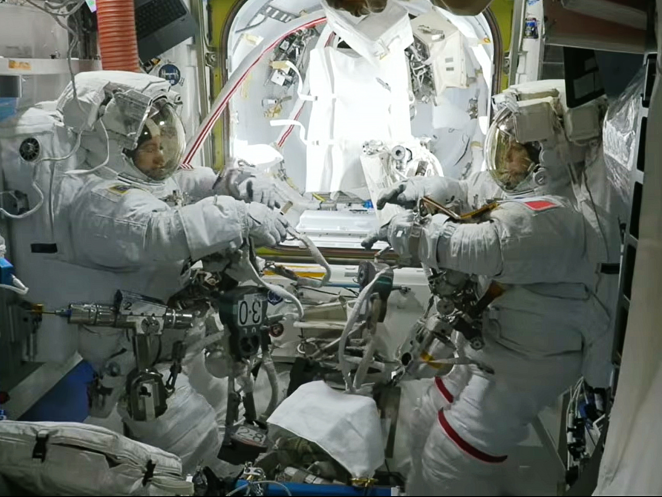 ESA, NASA Astronauts Suit Up for Navigation, Science Maintenance Spacewalk